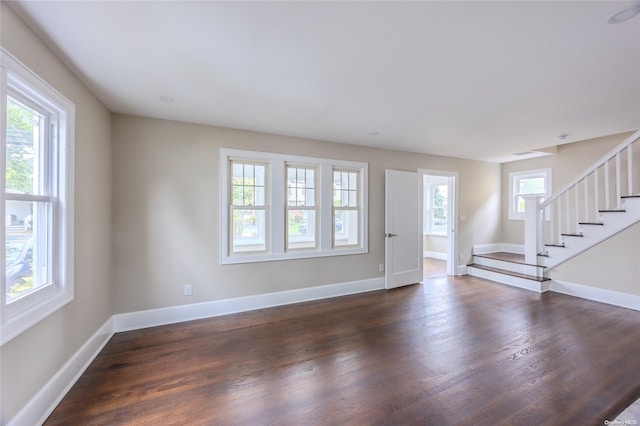 entryway with dark wood-type flooring