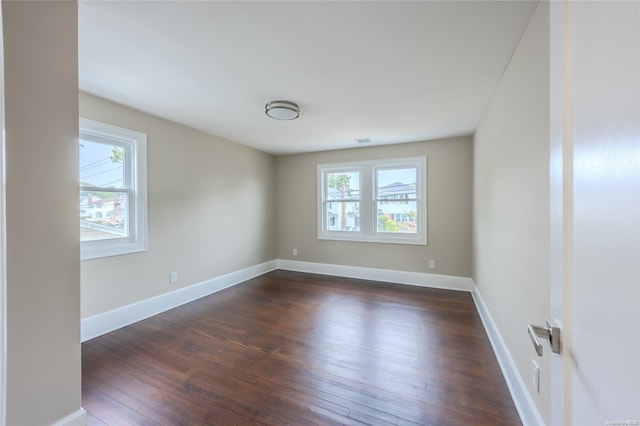 unfurnished room featuring dark hardwood / wood-style floors