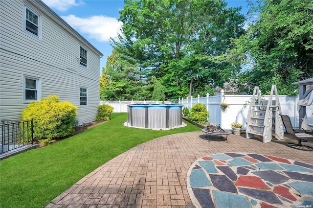 view of patio / terrace with a fenced in pool