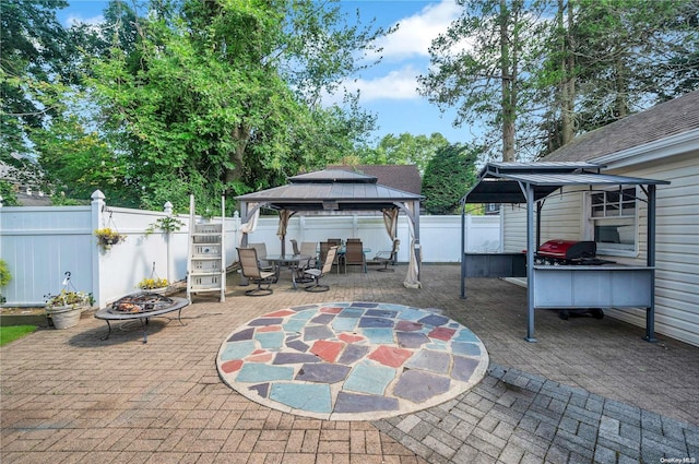 view of patio / terrace with a gazebo and an outdoor fire pit