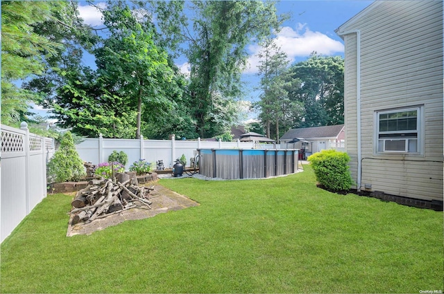 view of yard with a fenced in pool