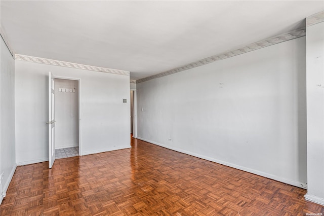 empty room featuring dark parquet floors