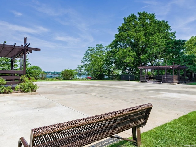 view of property's community with a pergola and a patio area