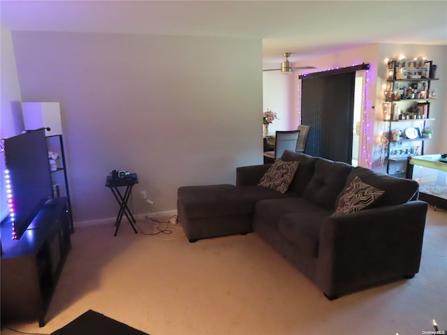 living room featuring carpet flooring and ceiling fan