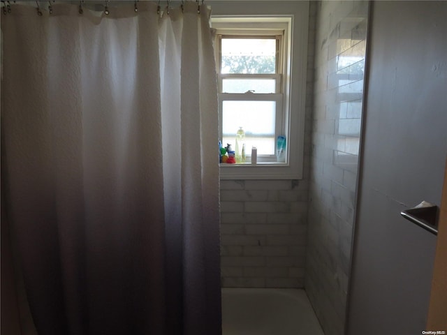 bathroom featuring shower / bath combination with curtain