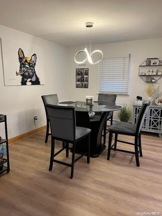 dining area with light hardwood / wood-style flooring