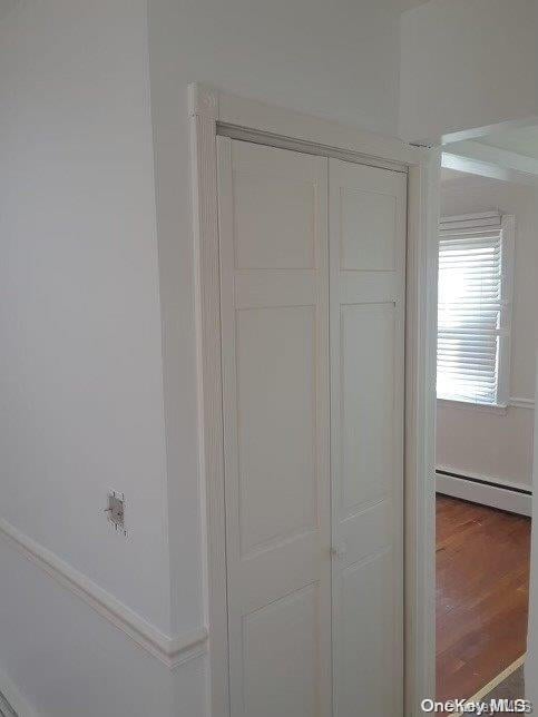 closet featuring a baseboard radiator