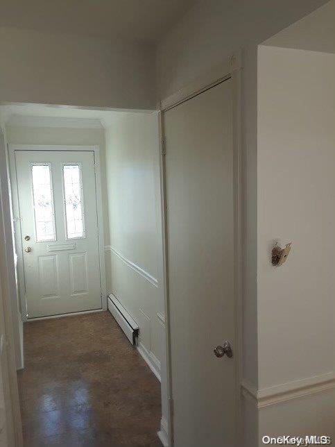 doorway to outside with baseboard heating