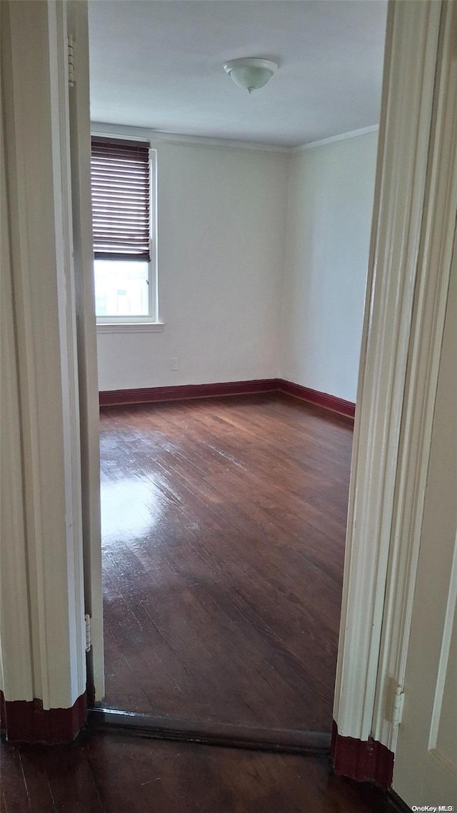 unfurnished room featuring dark hardwood / wood-style floors