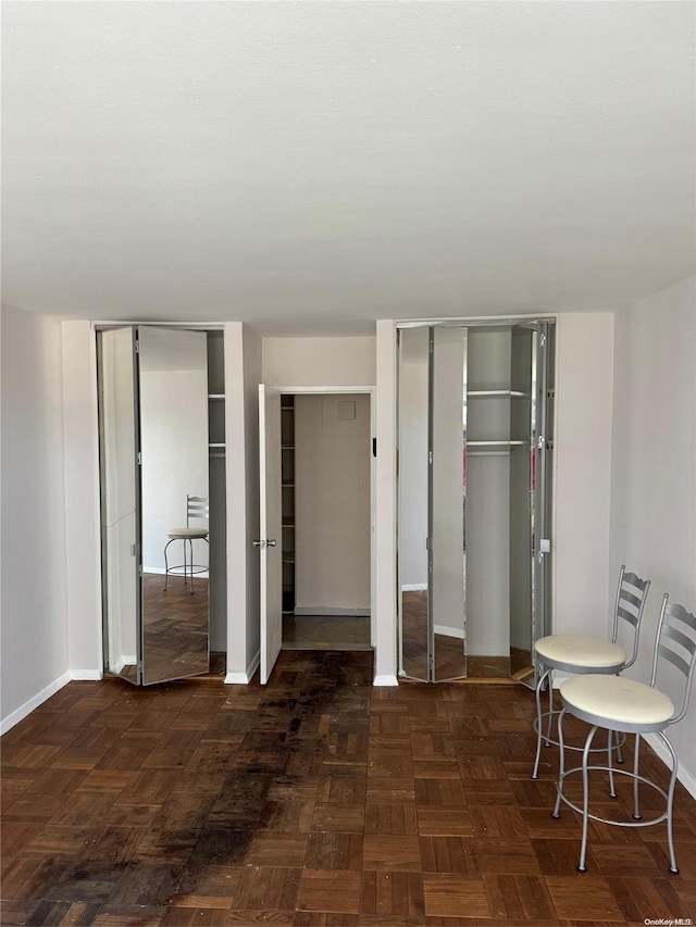17-85 215th St Unit 4J, Bayside, NY 11360 - bedroom with multiple closets and baseboards