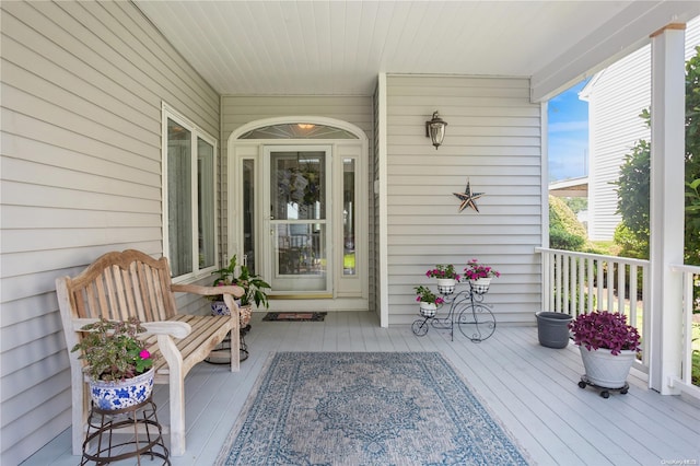 property entrance with covered porch