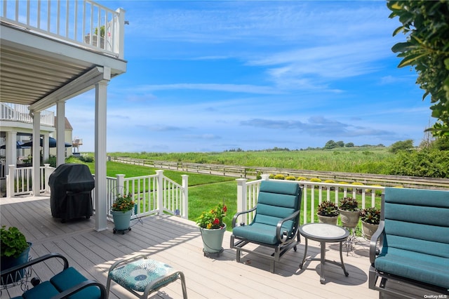 deck with a yard and grilling area