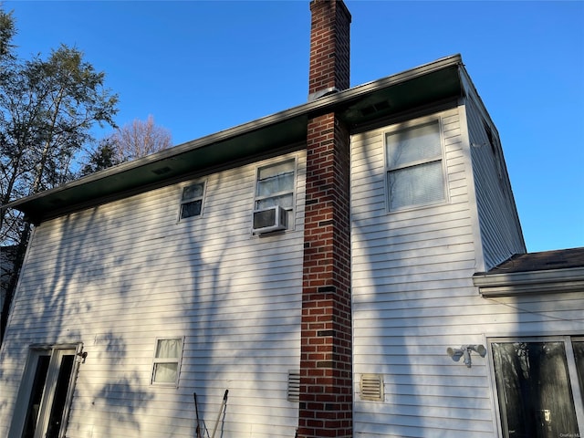 view of property exterior with cooling unit