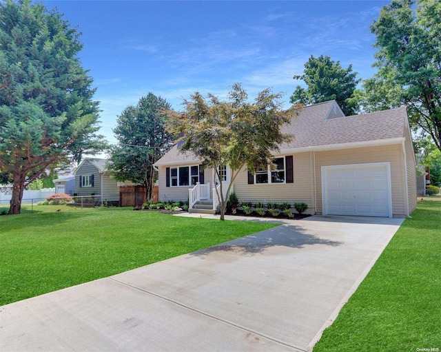 view of front of house with a garage and a front yard