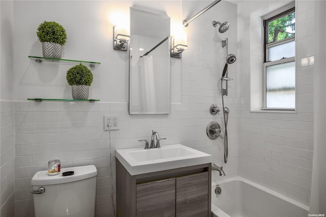 full bathroom featuring vanity, toilet, shower / bathtub combination with curtain, and tile walls