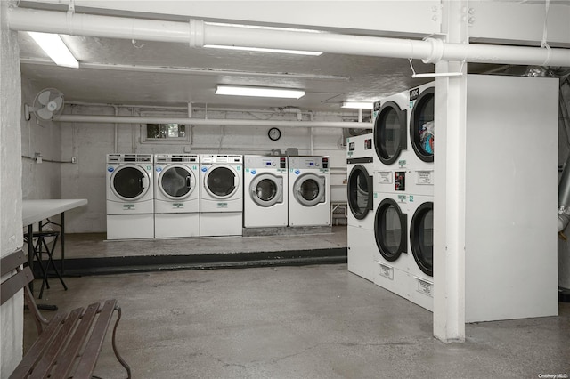 laundry room with washer and dryer and stacked washer / drying machine