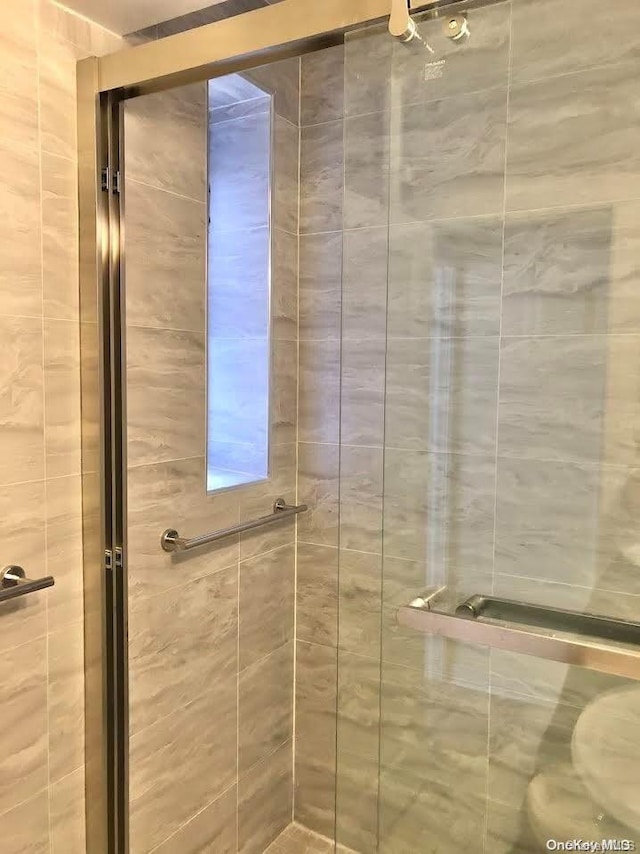 bathroom featuring an enclosed shower