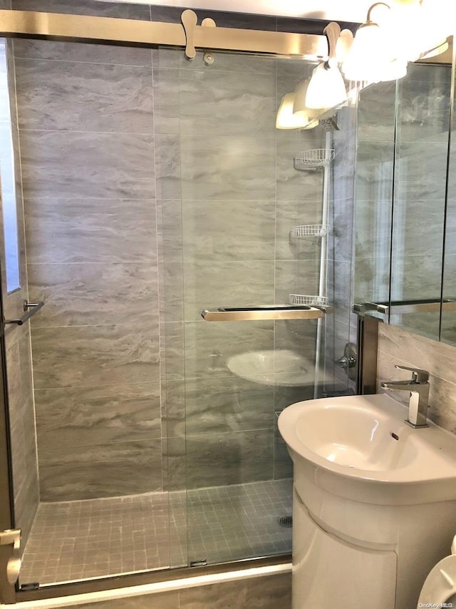 bathroom with vanity and walk in shower