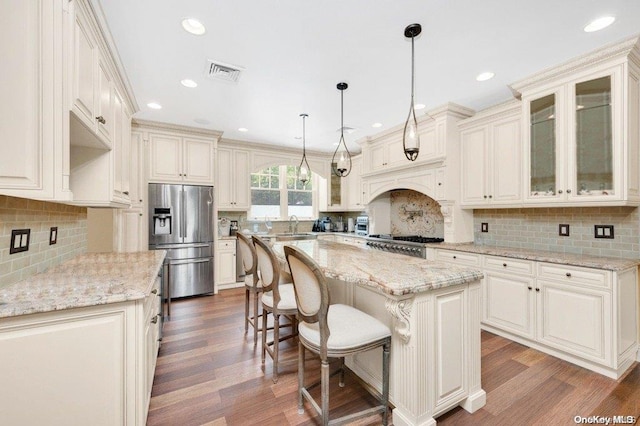 262 Howard Ave, Staten Island, NY 10301 - kitchen with stainless steel fridge, tasteful backsplash, dark wood finished floors, and recessed lighting