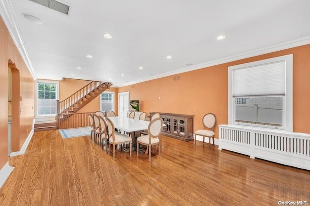 262 Howard Ave, Staten Island, NY 10301 - dining space featuring crown molding, wood finished floors, baseboards, stairs, and recessed lighting