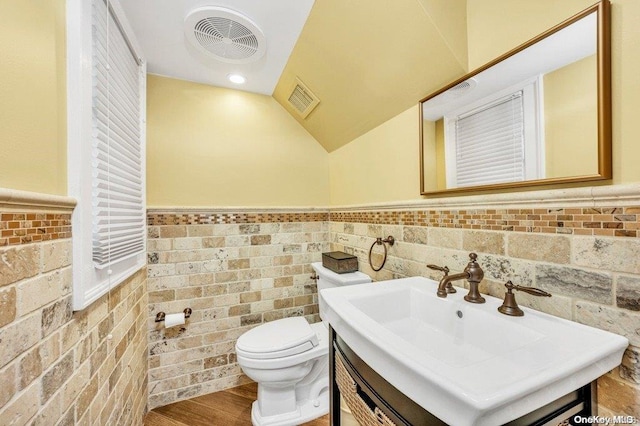 262 Howard Ave, Staten Island, NY 10301 - half bath featuring toilet, a wainscoted wall, vanity, and lofted ceiling