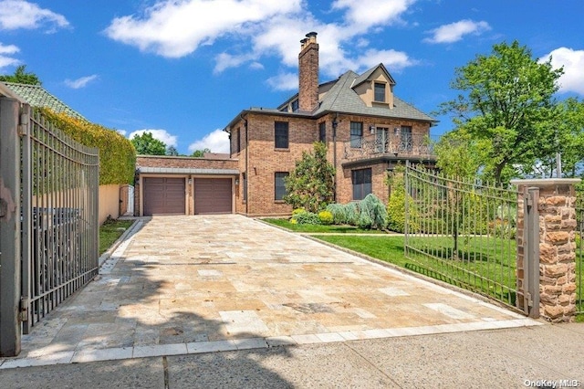 262 Howard Ave, Staten Island, NY 10301 - view of front of property featuring brick siding, an attached garage, concrete driveway, a chimney, and a gate
