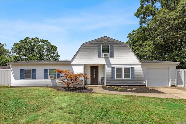 view of front of house featuring a front lawn and a garage