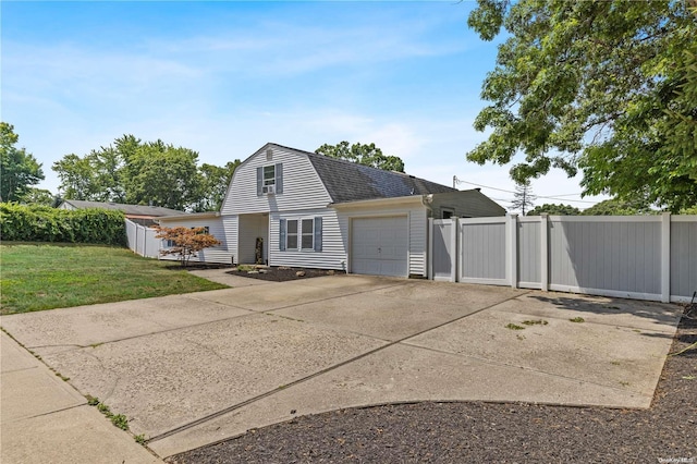 view of side of home with a yard and a garage