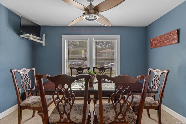 tiled dining space featuring ceiling fan