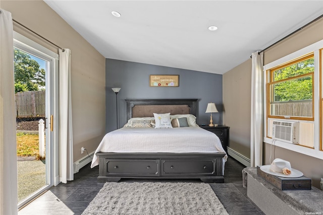 bedroom featuring multiple windows, lofted ceiling, and a baseboard heating unit