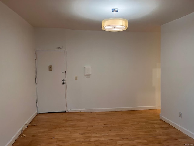 unfurnished room with light wood-type flooring