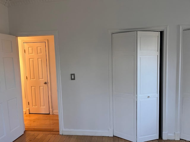 unfurnished bedroom with light hardwood / wood-style floors