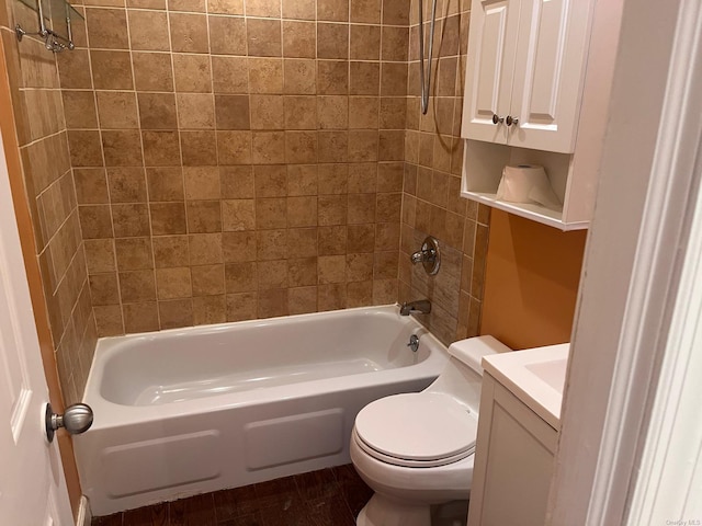 full bathroom with vanity, toilet, and tiled shower / bath combo