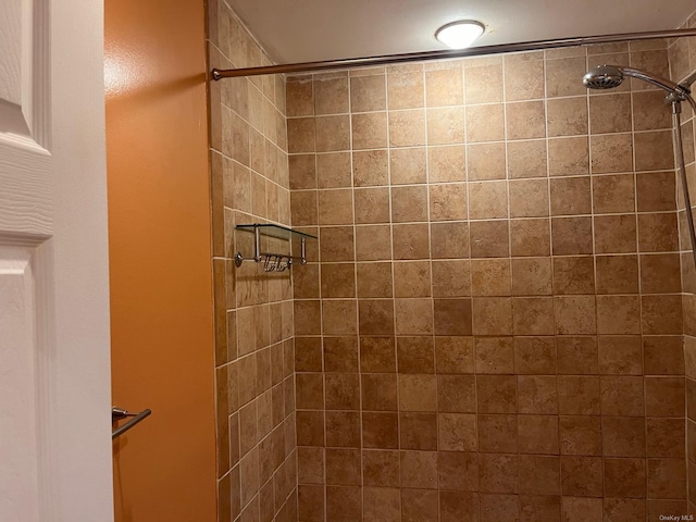 bathroom with tiled shower