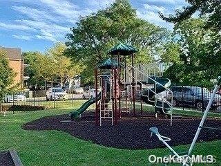 view of jungle gym with a lawn