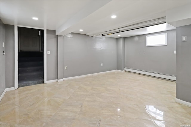 basement featuring a baseboard heating unit