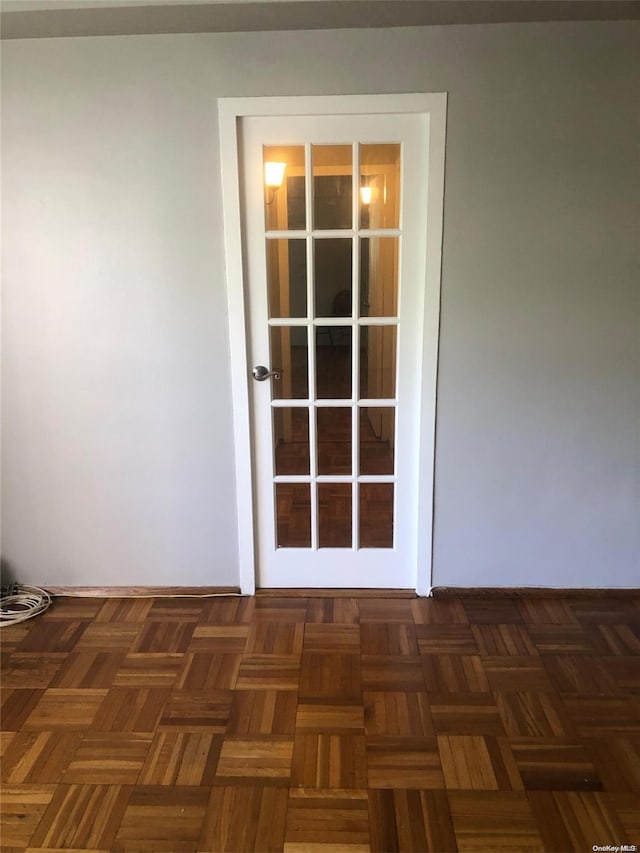 interior space featuring dark parquet flooring