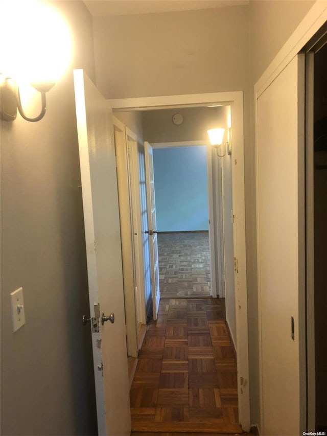 hallway with dark parquet floors