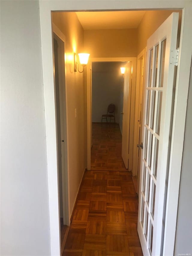 hallway with dark parquet floors