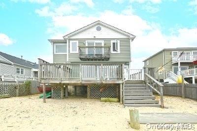 190 Bayview Ave, Lindenhurst, NY 11757 - back of property with a wooden deck