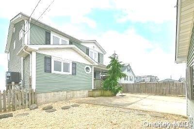 190 Bayview Ave, Lindenhurst, NY 11757 - view of home's exterior featuring a patio