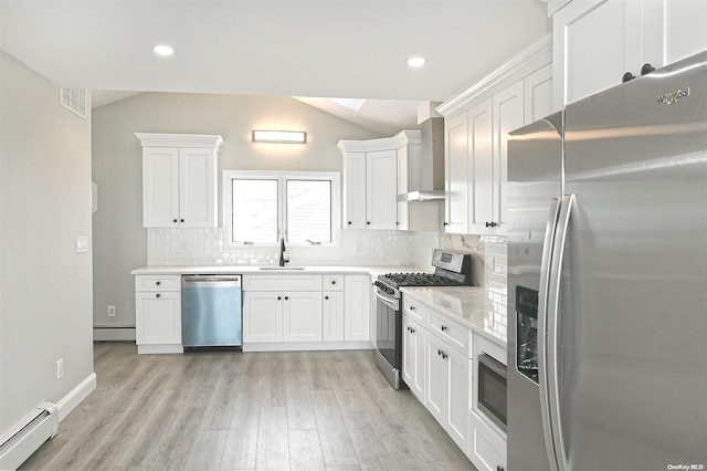 190 Bayview Ave, Lindenhurst, NY 11757 - kitchen with stainless steel appliances, a baseboard radiator, wall chimney exhaust hood, a sink, and white cabinetry