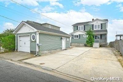 190 Bayview Ave, Lindenhurst, NY 11757 - view of front of house with an outdoor structure and driveway