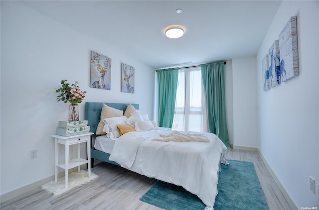 bedroom with light wood-type flooring