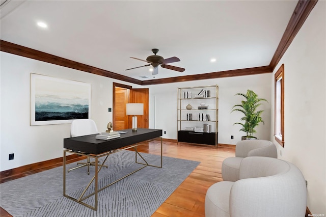 office area featuring hardwood / wood-style flooring, ceiling fan, and ornamental molding