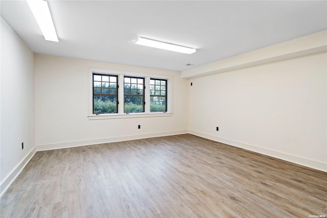 spare room with light wood-type flooring