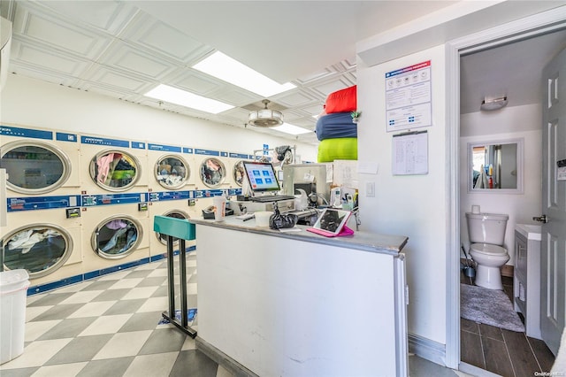 washroom with independent washer and dryer