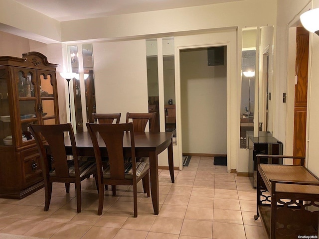 dining room featuring light tile patterned flooring