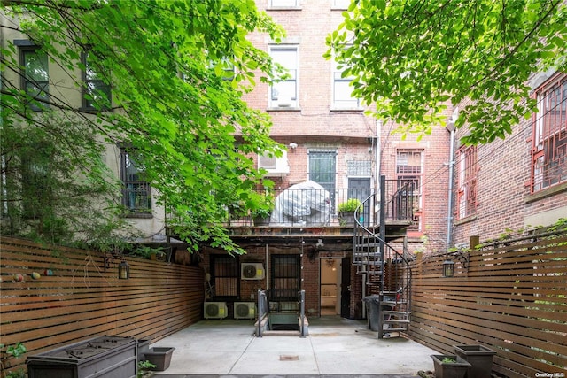 rear view of property featuring a patio