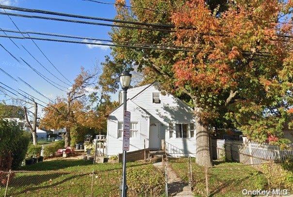 view of side of home featuring a yard